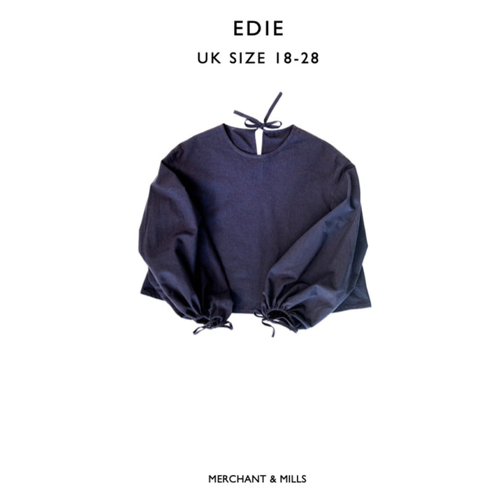 Navy blue blouse with balloon sleeves on a white background, labeled 'EDIE' and 'Merchant & Mills'.