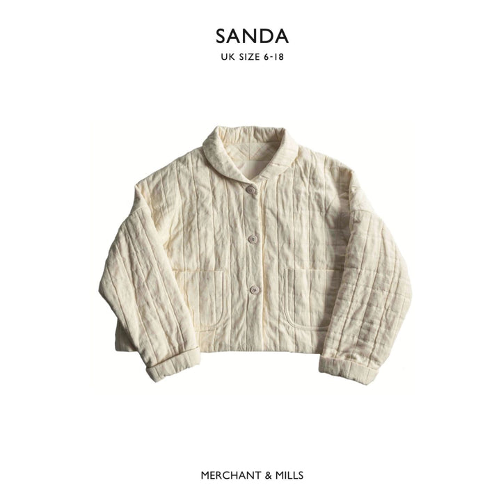 Beige textured jacket on a white background with 'SANDA' and 'MERCHANT & MILLS' branding.