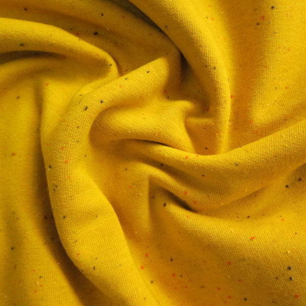 Mustard yellow fleeceback sweatshirt fabric with colourful flecks.