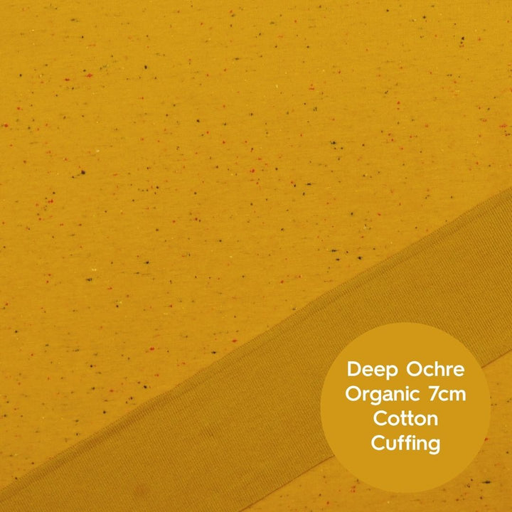 Mustard yellow fleeceback sweatshirt fabric with colourful flecks.