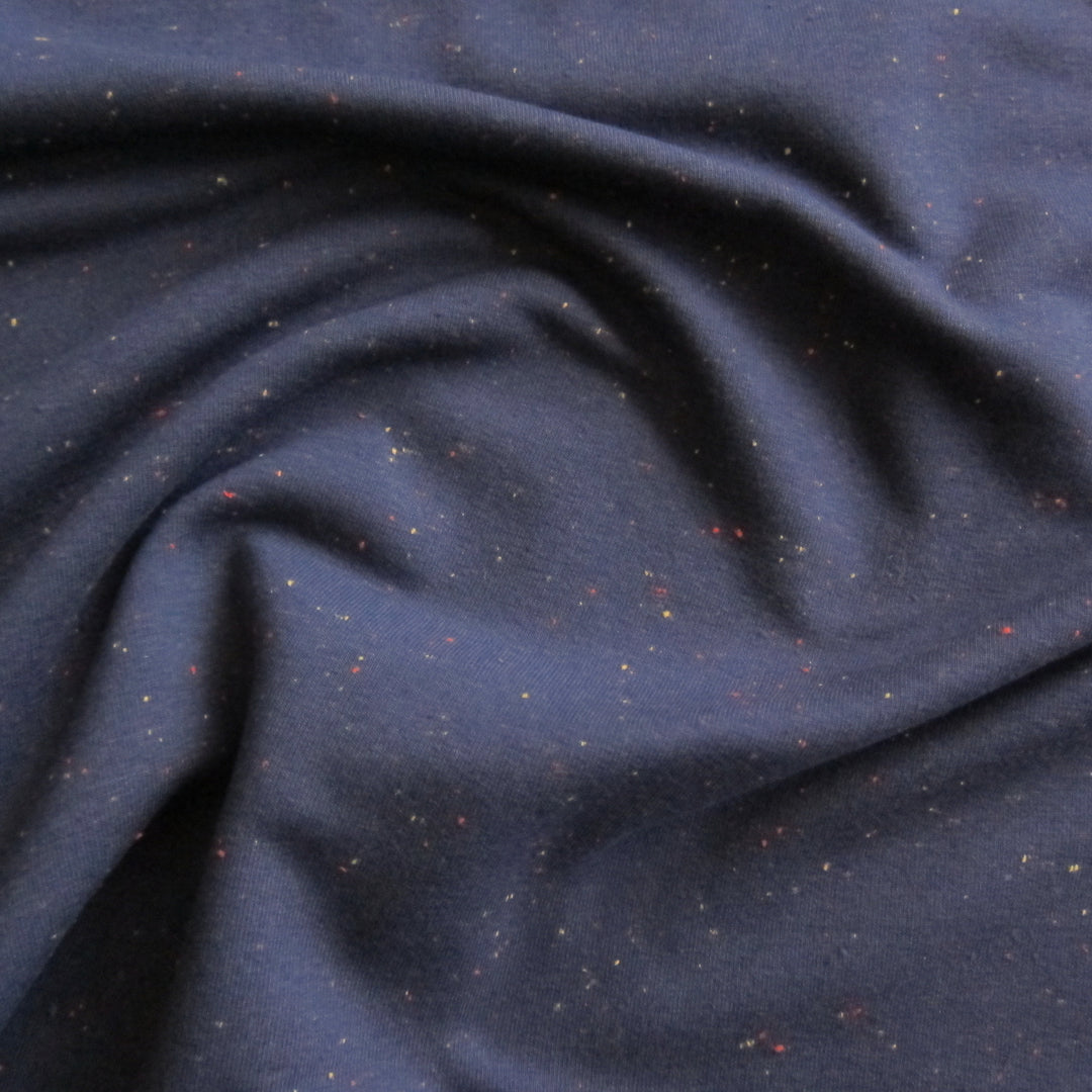 Navy multi fleck cotton fleece sweatshirt fabric with soft fleeceback texture.
