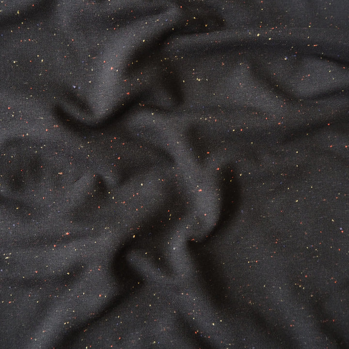 Black fleeceback sweatshirt fabric with subtle colourful flecks.