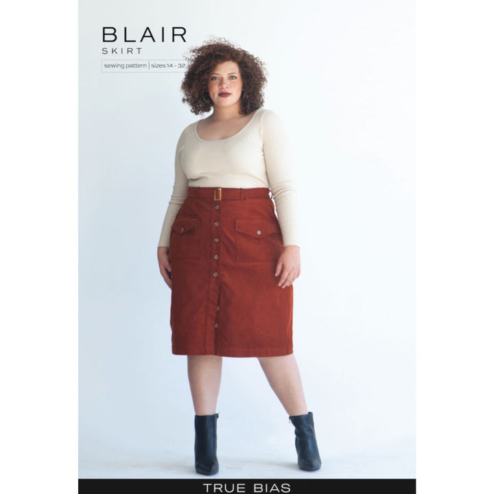 Model wearing a red skirt with buttons, standing against a white background, with 'Blair Skirt' text above.
