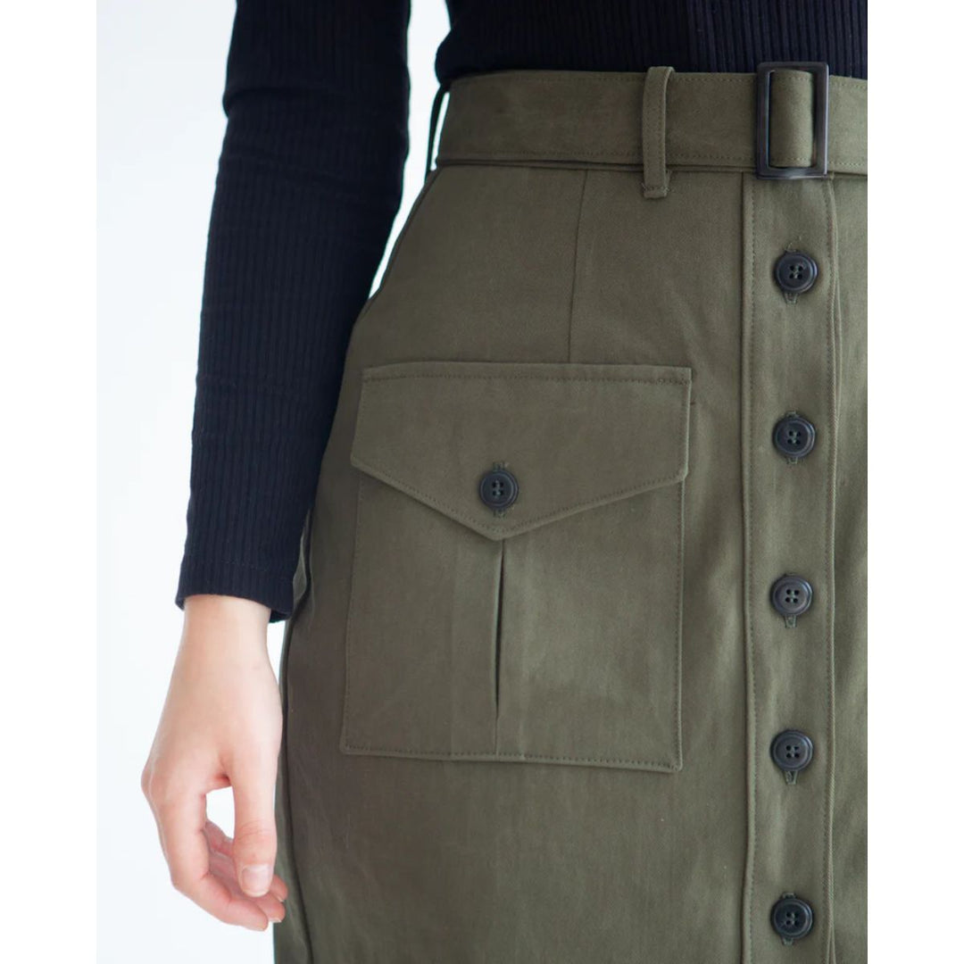 Green skirt with button details on a white background