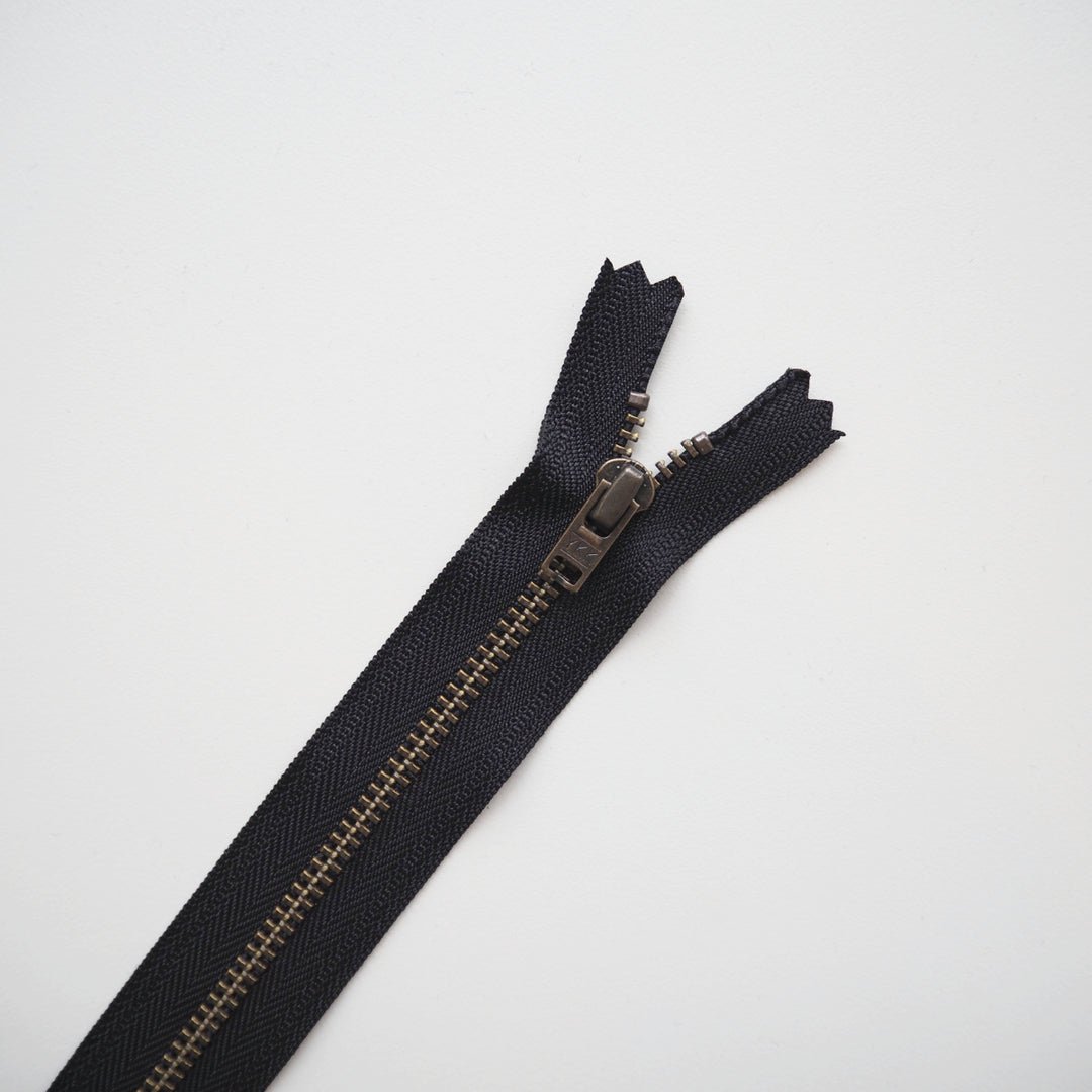 Black zipper on a light gray background