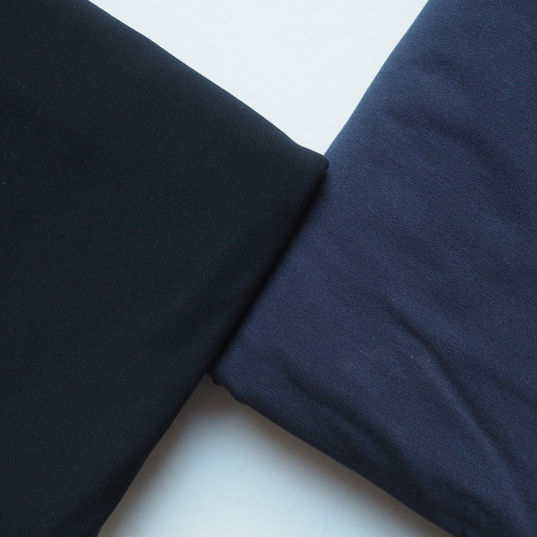 close up of a navy and black, low pill micro modal jersey used for Avery leggings in soft matte finish