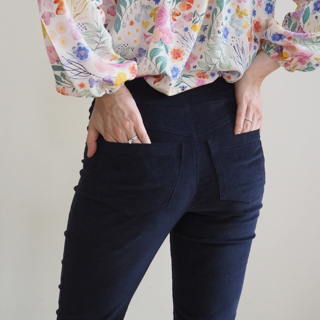 Back view of Eleonore trousers showing shaped yoke and patch pockets