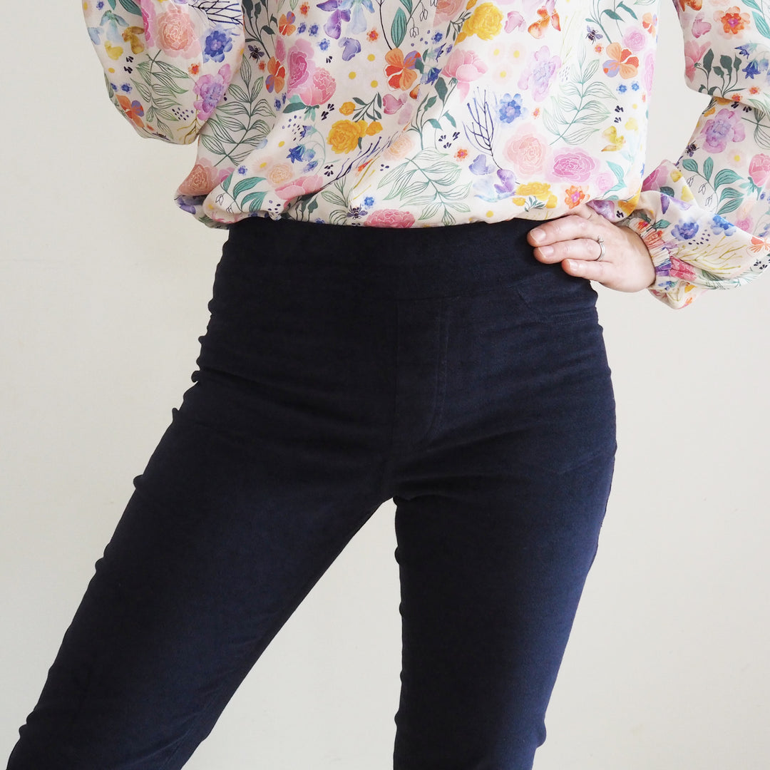 Stretch waistband construction on Eleonore trousers for easy pull on fit. Close up of the front view