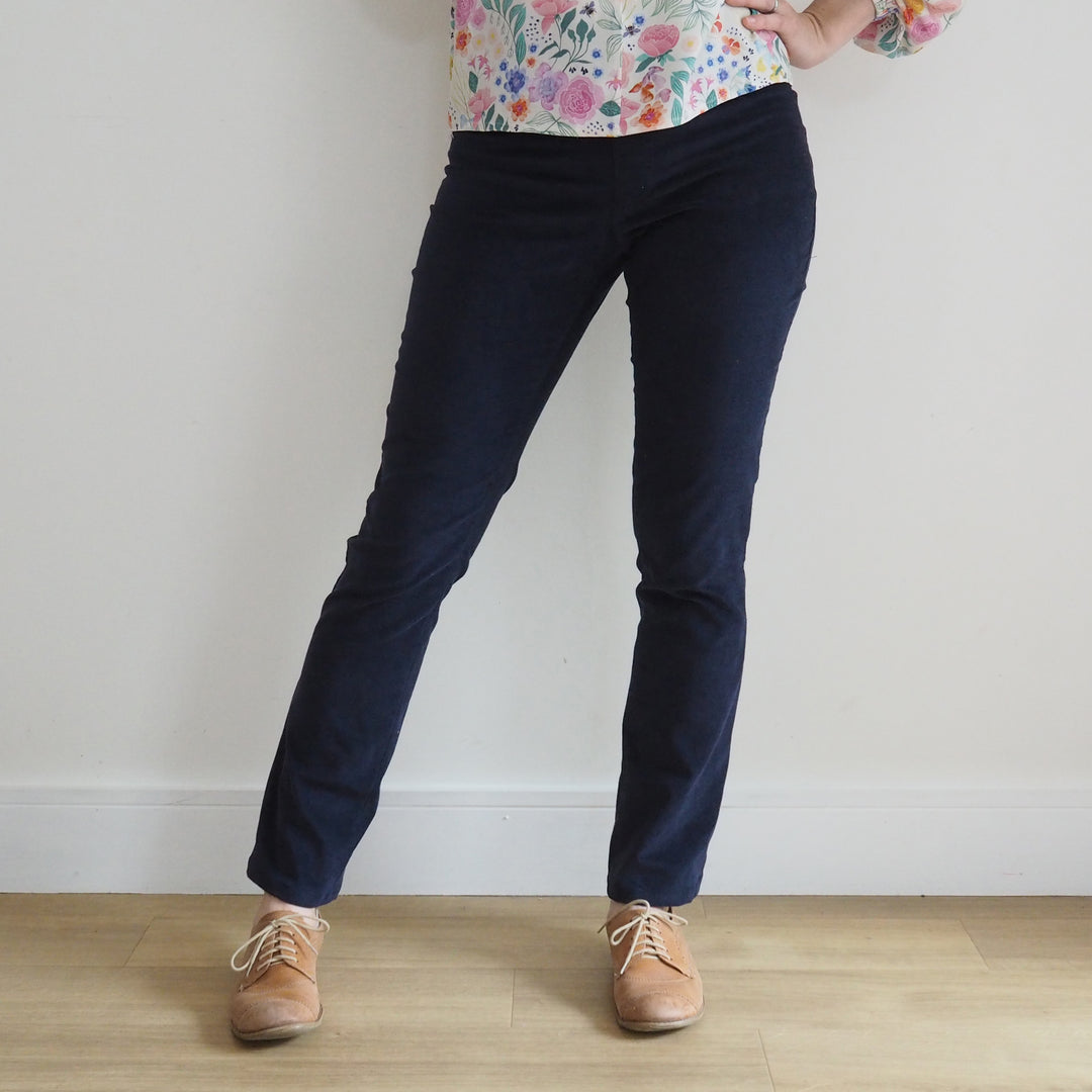 Model wearing Eleonore stretch pull on trousers with mid rise fit and straight leg shape