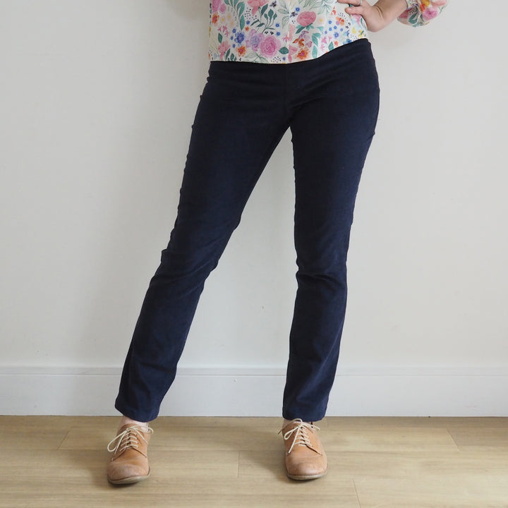 Model wearing Eleonore stretch pull on trousers with mid rise fit and straight leg shape