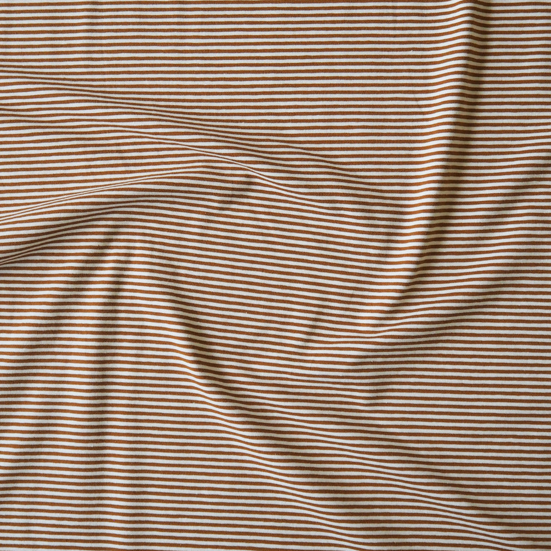 Striped cotton jersey fabric with brown-orange and white stripes