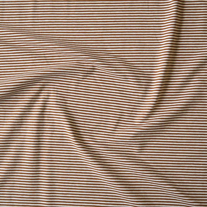 Striped cotton jersey fabric with brown-orange and white stripes