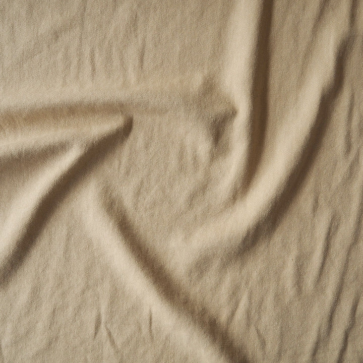 Natural sand-coloured 100% hemp fabric for sustainable dressmaking.