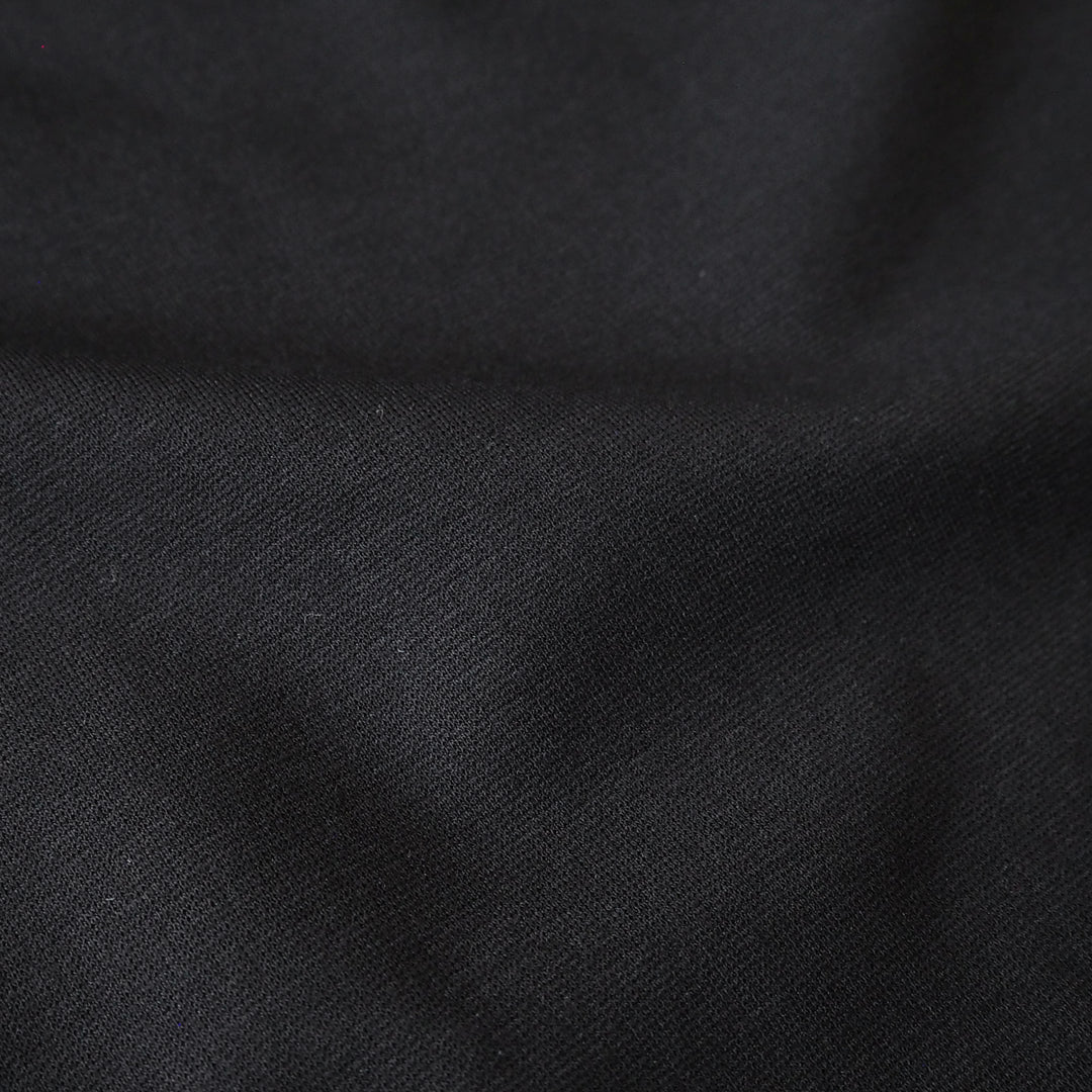 Black viscose ponte jersey fabric for dressmaking.