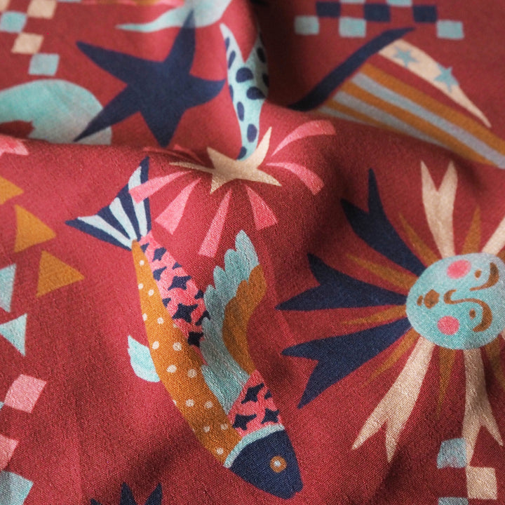 Fabric Godmother Soleil Maroon Viscose Crepe Fabric – maroon viscose crepe with celestial print