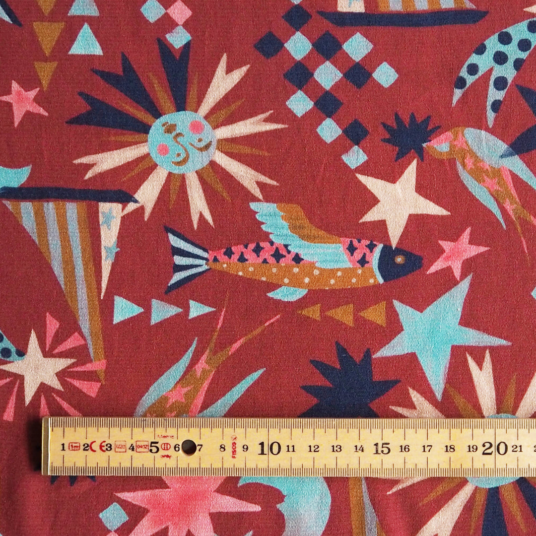 Fabric Godmother Soleil Maroon Viscose Crepe Fabric – maroon viscose crepe with celestial print