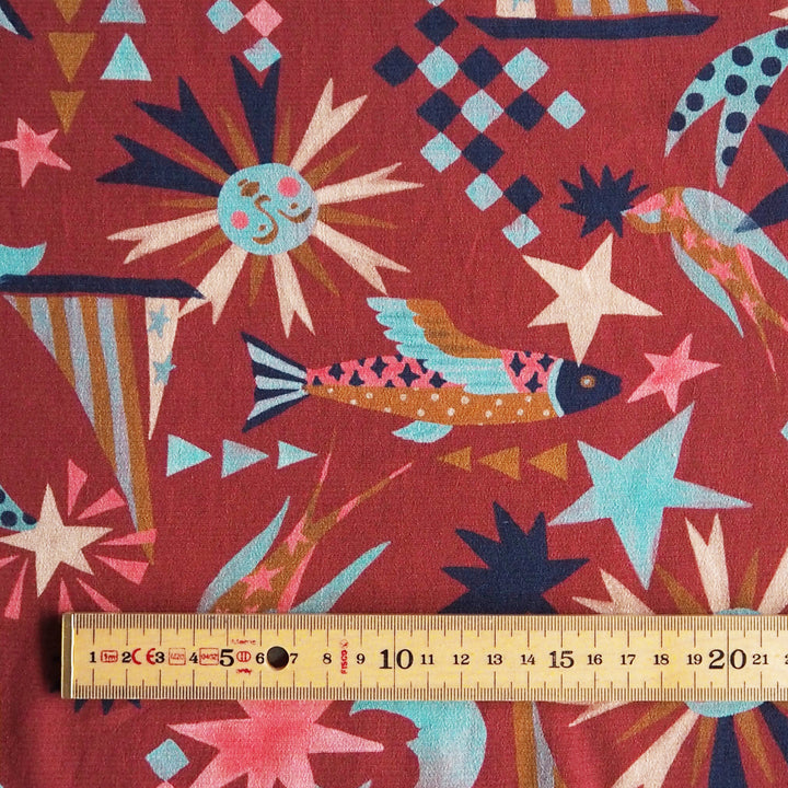 Fabric Godmother Soleil Maroon Viscose Crepe Fabric – maroon viscose crepe with celestial print