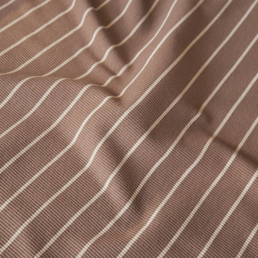 Brown striped ribbed jersey fabric with white stripes
