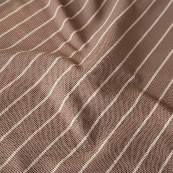 Brown striped ribbed jersey fabric with white stripes