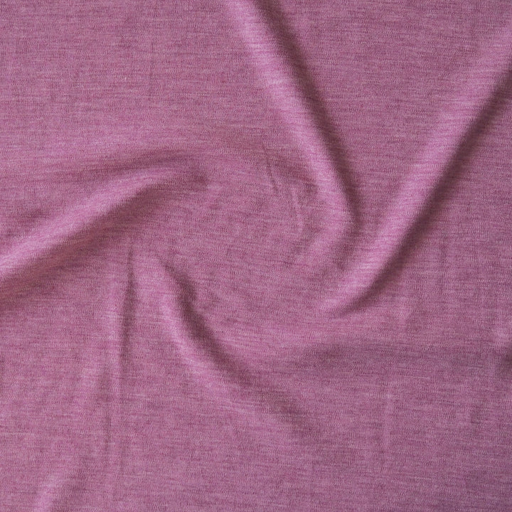 Close-up of pink merino wool jersey fabric with visible texture