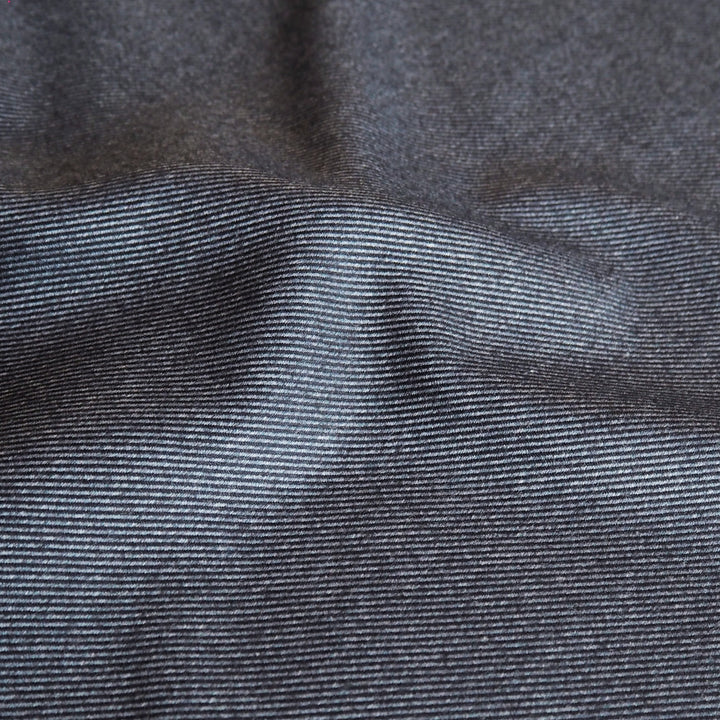 Muted denim stripe bamboo blended twill fabric in soft blue tones