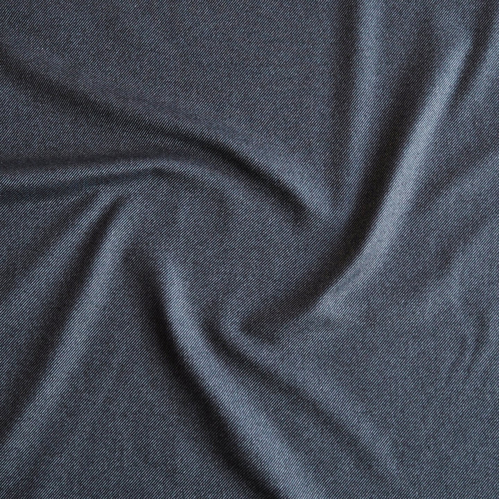 Muted denim stripe bamboo blended twill fabric in soft blue tones
