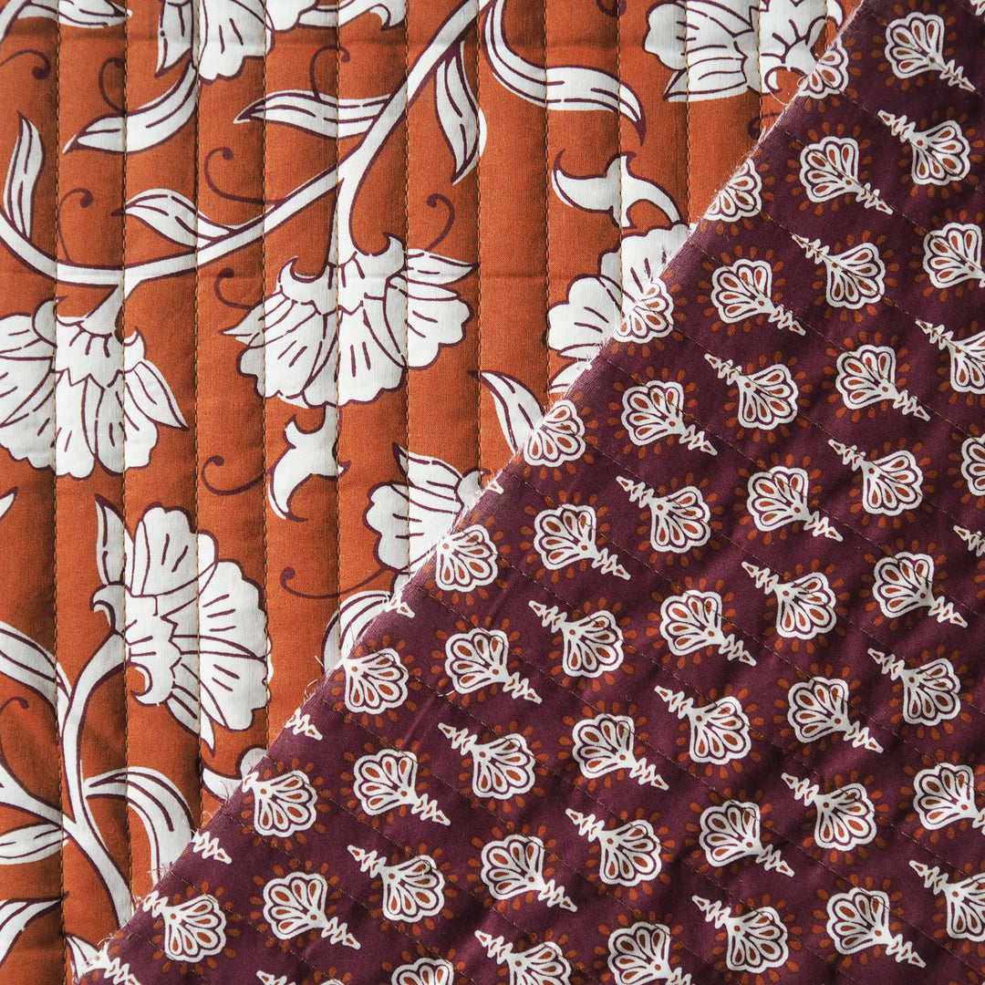Terracotta Garden reversible quilted cotton fabric with rust floral design