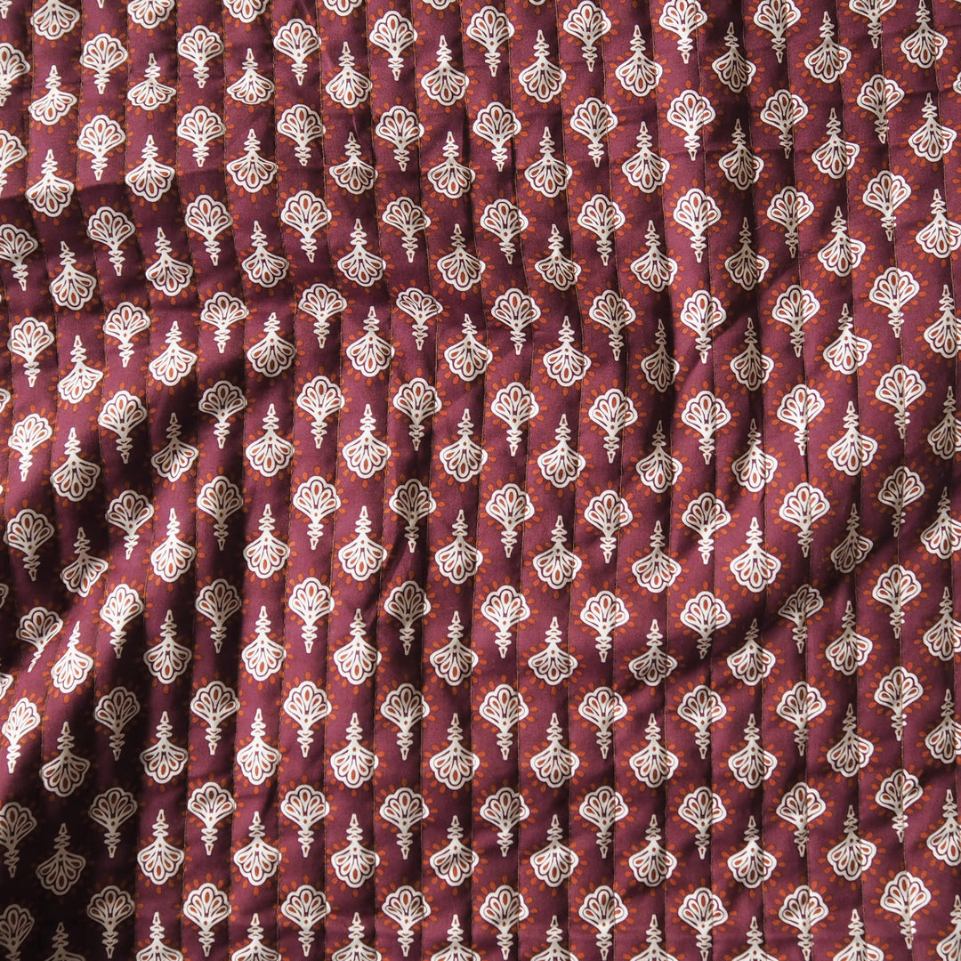 Terracotta Garden reversible quilted cotton fabric with rust floral design