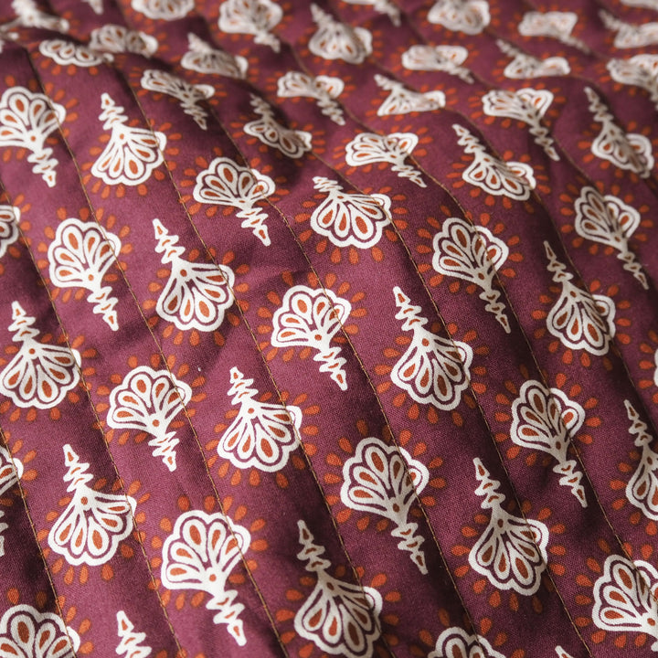 Terracotta Garden reversible quilted cotton fabric with rust floral design