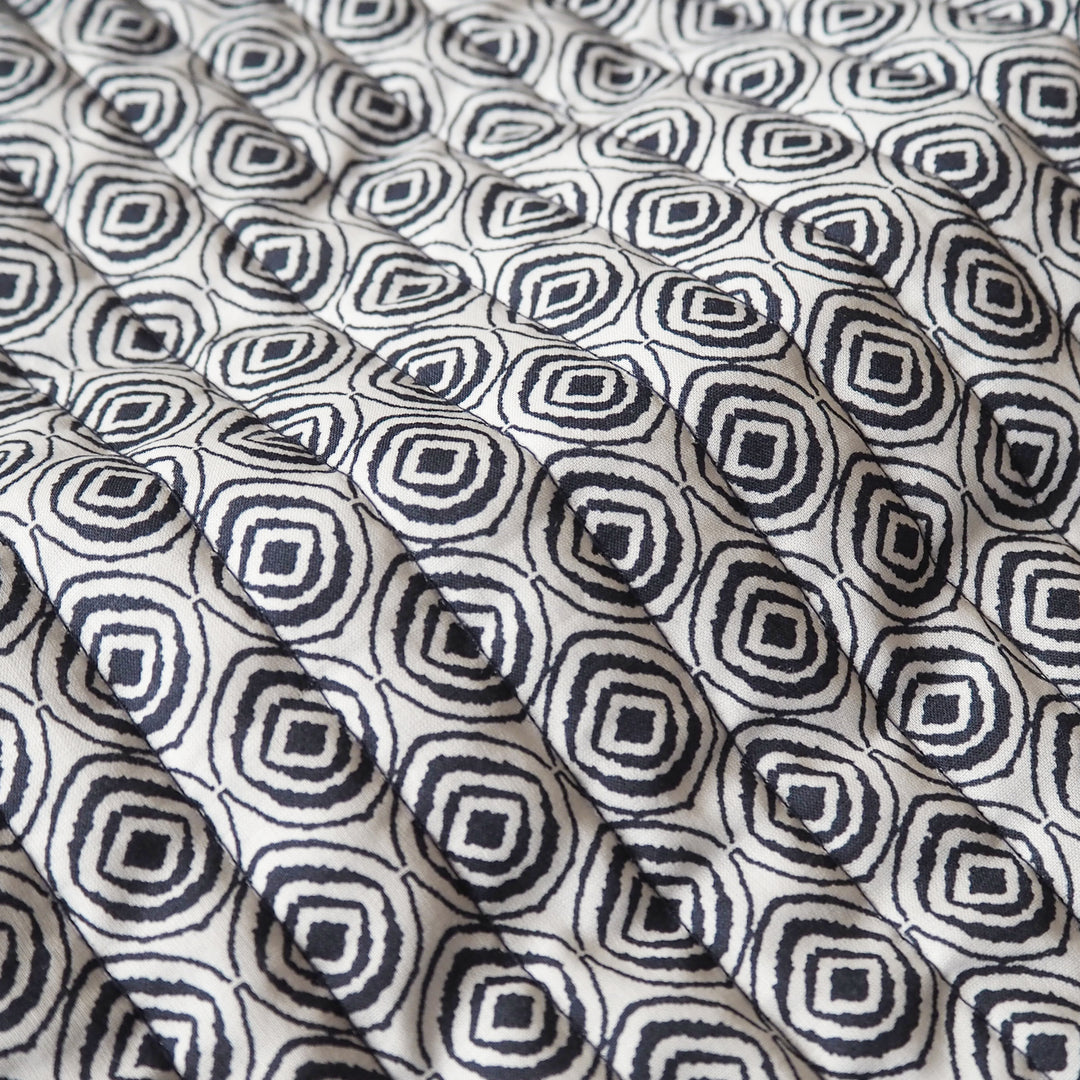 Indigo Botanica reversible quilted cotton fabric with detailed floral design