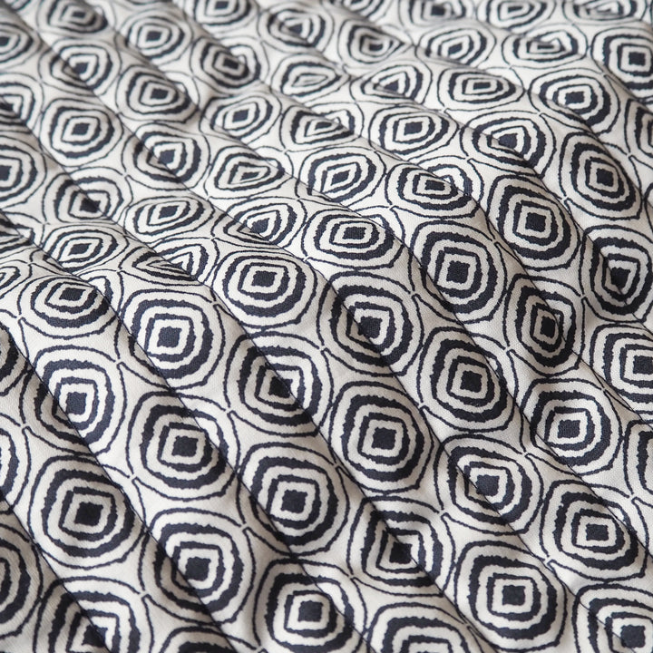 Indigo Botanica reversible quilted cotton fabric with detailed floral design