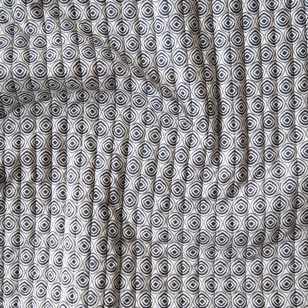 Indigo Botanica reversible quilted cotton fabric with detailed floral design