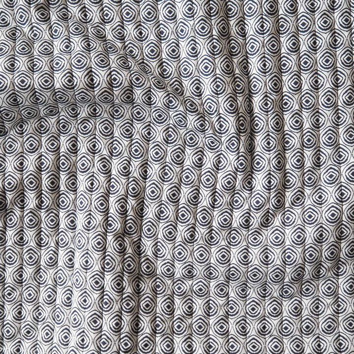 Indigo Botanica reversible quilted cotton fabric with detailed floral design