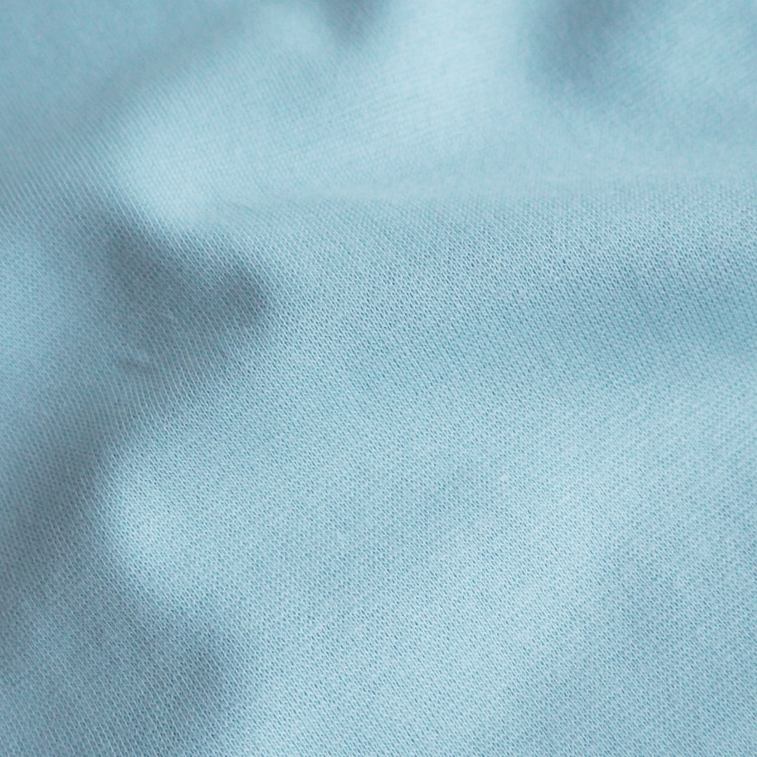 Close-up of light blue fabric texture