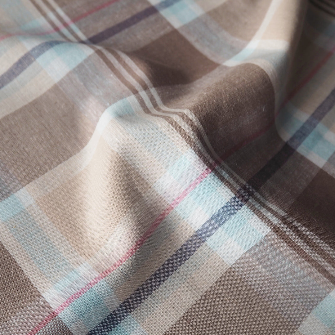 Neutral coloured checked viscose linen dressmaking fabric