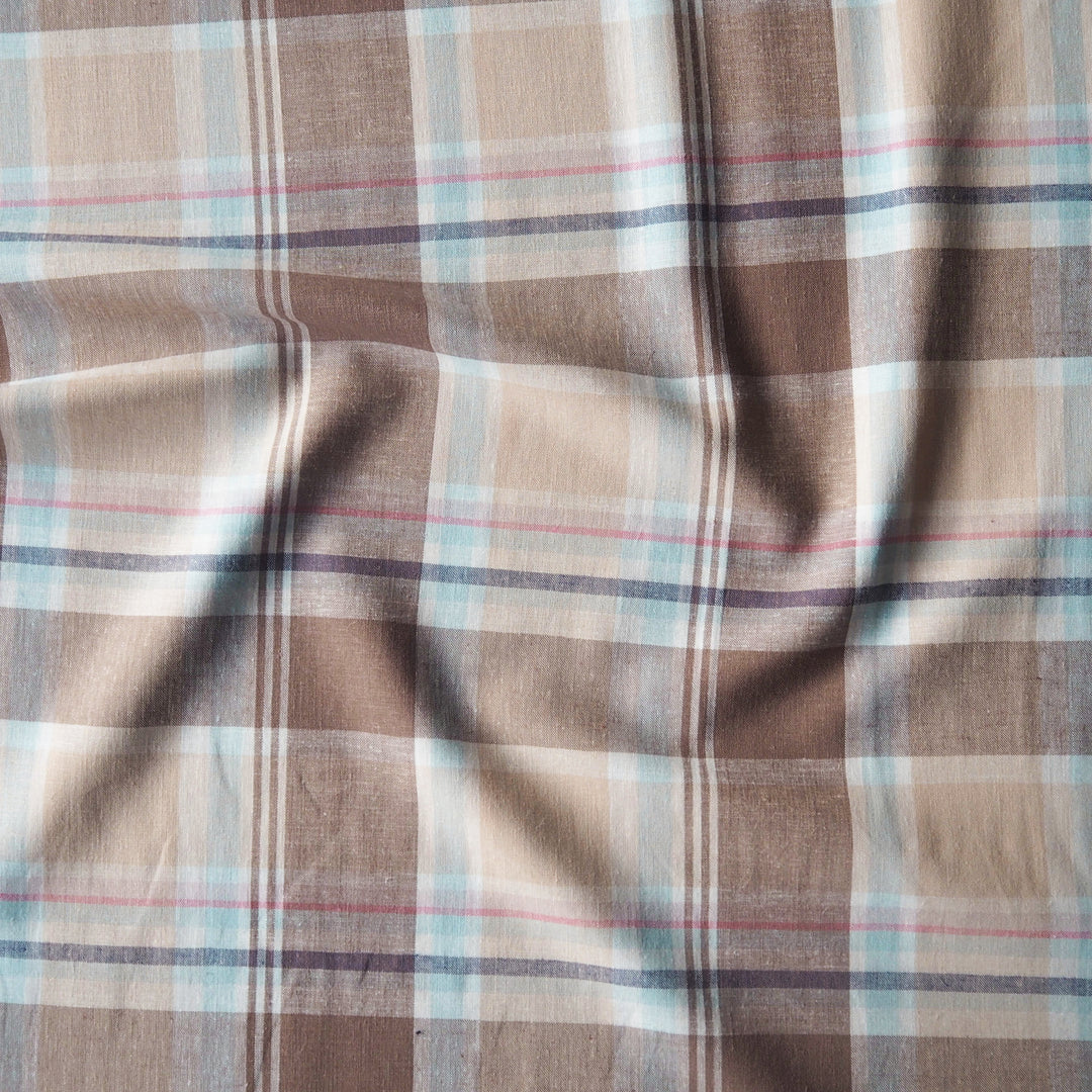 Neutral coloured checked viscose linen dressmaking fabric