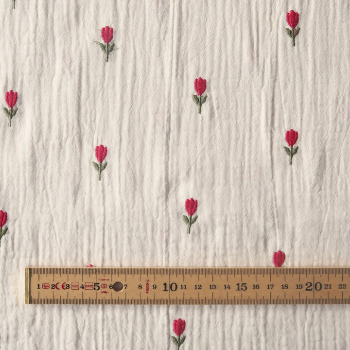 Ecru cotton double gauze fabric with embroidered tulip flowers