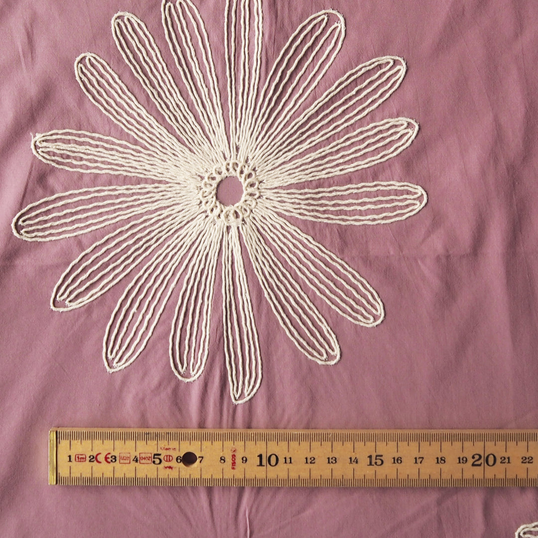 Dusky pink large scale embroidered daisy cotton dressmaking fabric