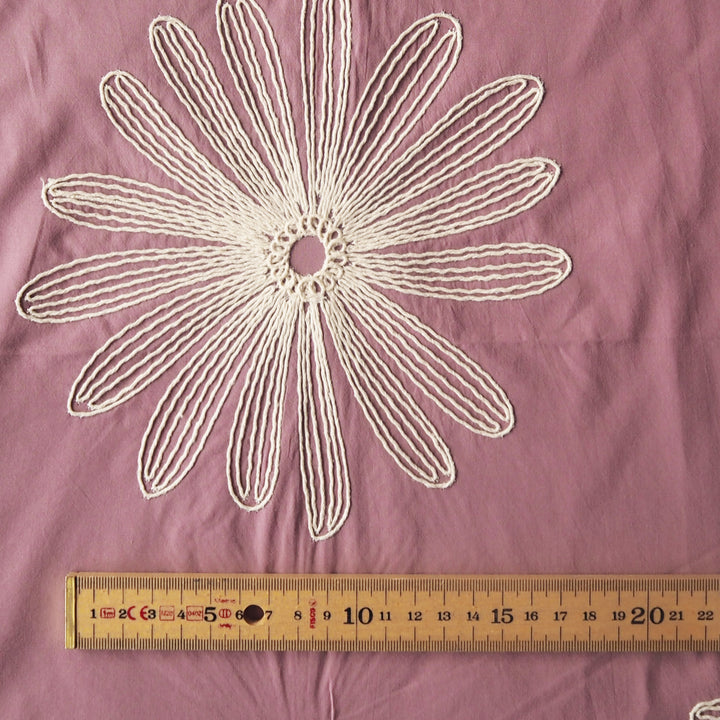 Dusky pink large scale embroidered daisy cotton dressmaking fabric