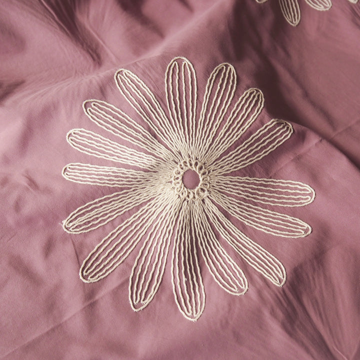 Dusky pink large scale embroidered daisy cotton dressmaking fabric