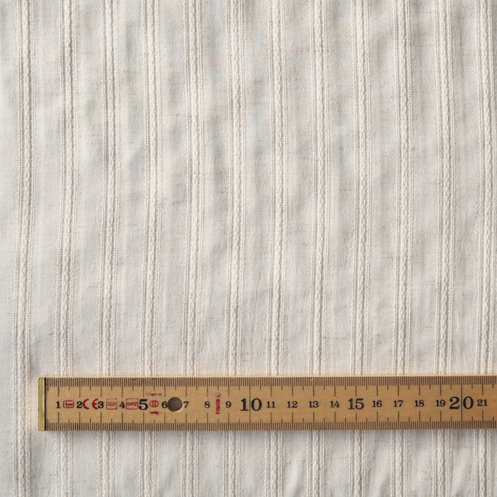 Cream striped cotton jacquard dressmaking fabric
