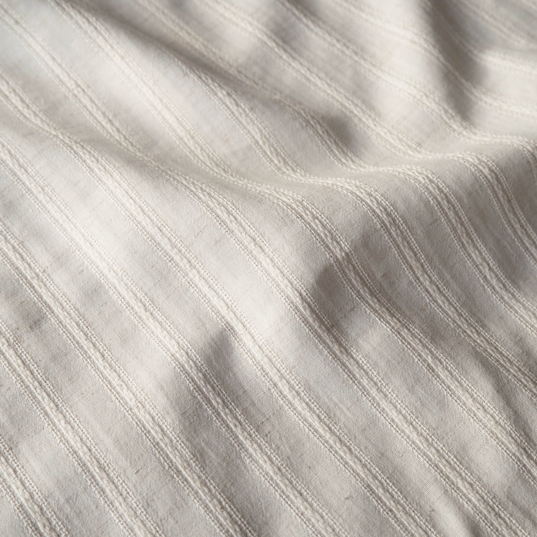 Cream striped cotton jacquard dressmaking fabric