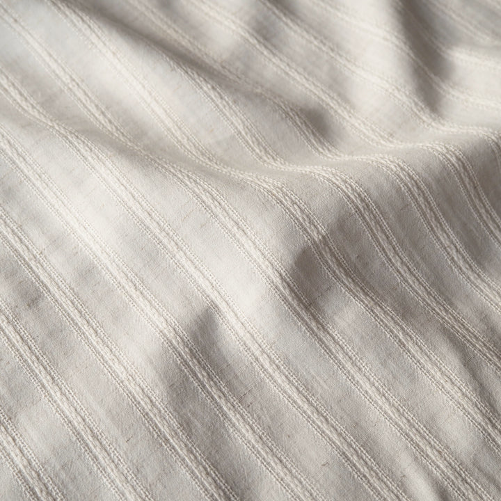 Cream striped cotton jacquard dressmaking fabric