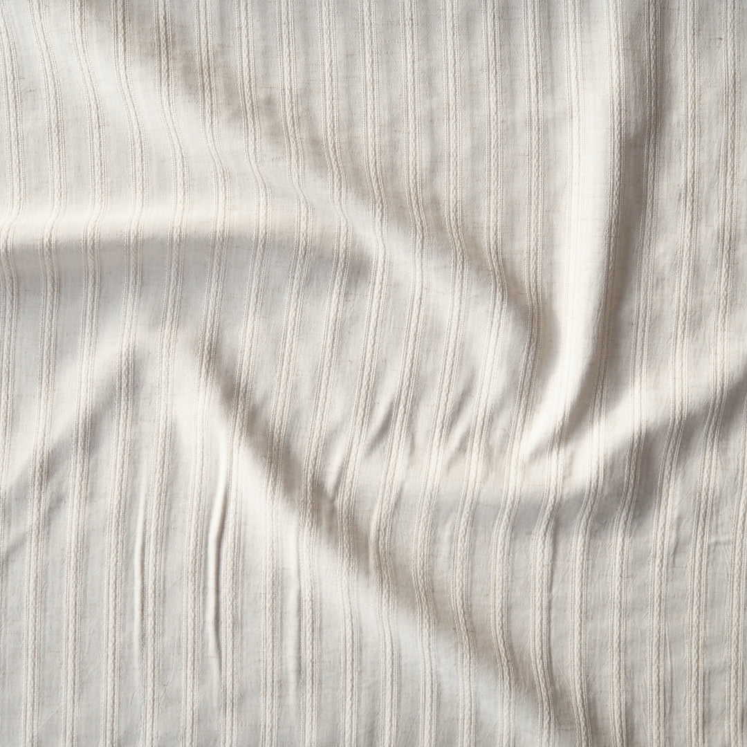 Cream striped cotton jacquard dressmaking fabric