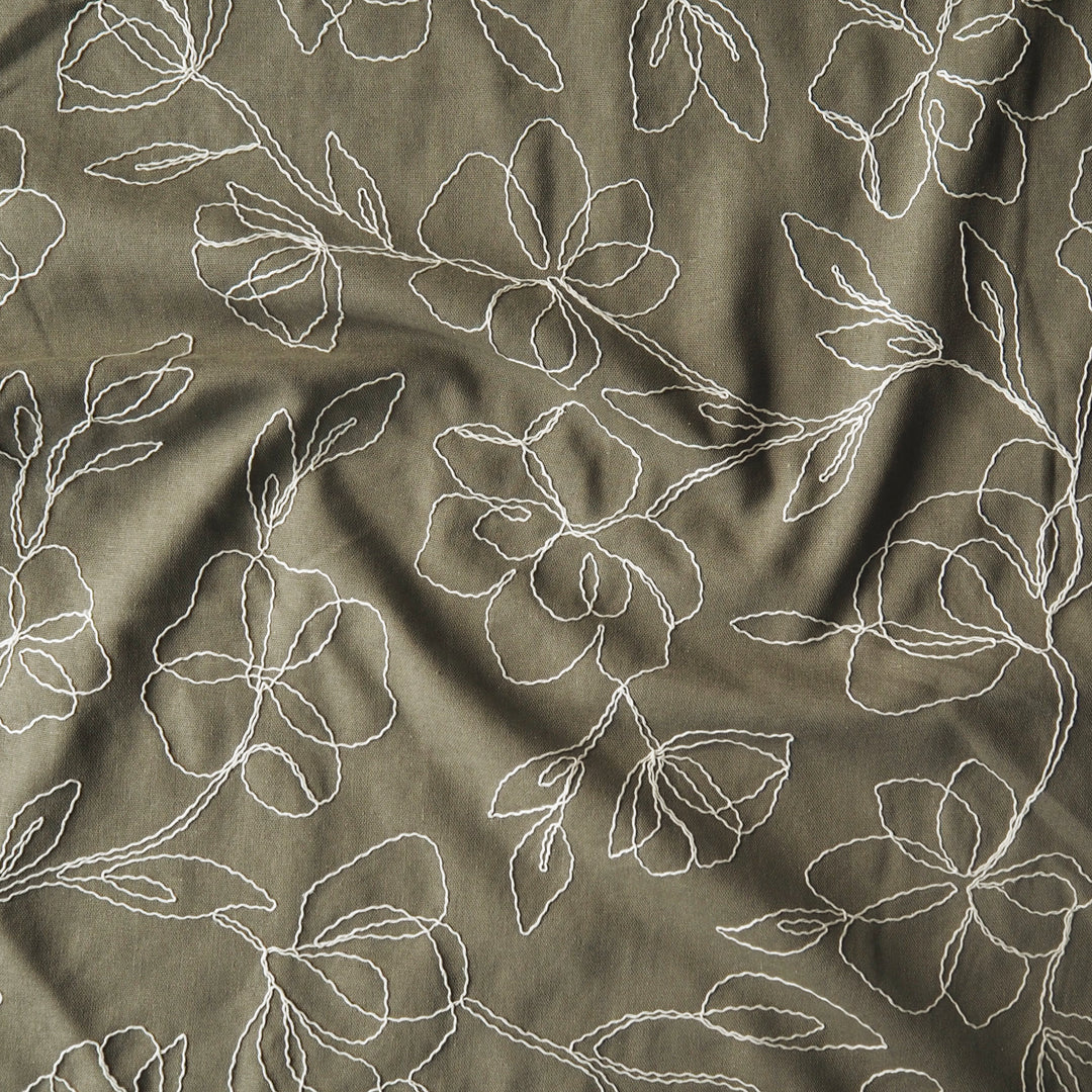 Khaki viscose linen dressmaking fabric with embroidered floral pattern