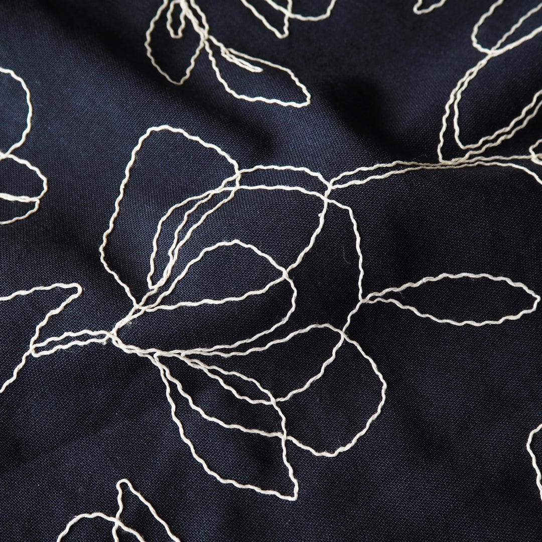 Navy viscose linen dressmaking fabric with embroidered floral pattern