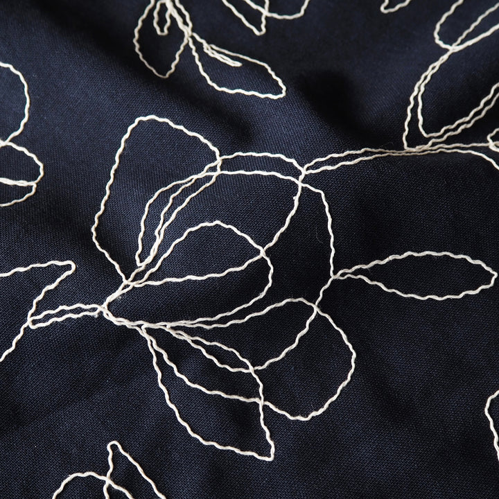 Navy viscose linen dressmaking fabric with embroidered floral pattern