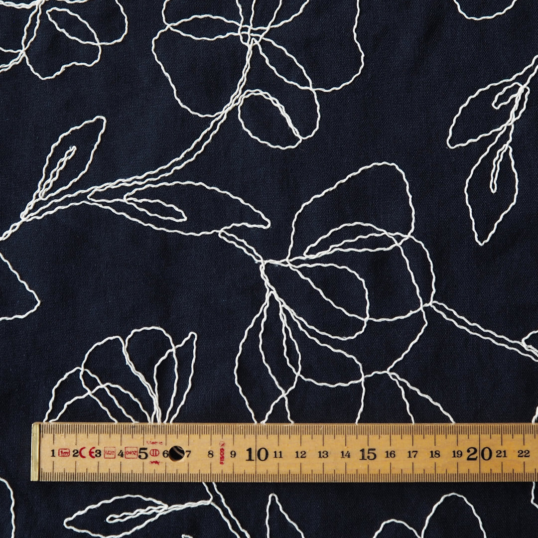 Navy viscose linen dressmaking fabric with embroidered floral pattern