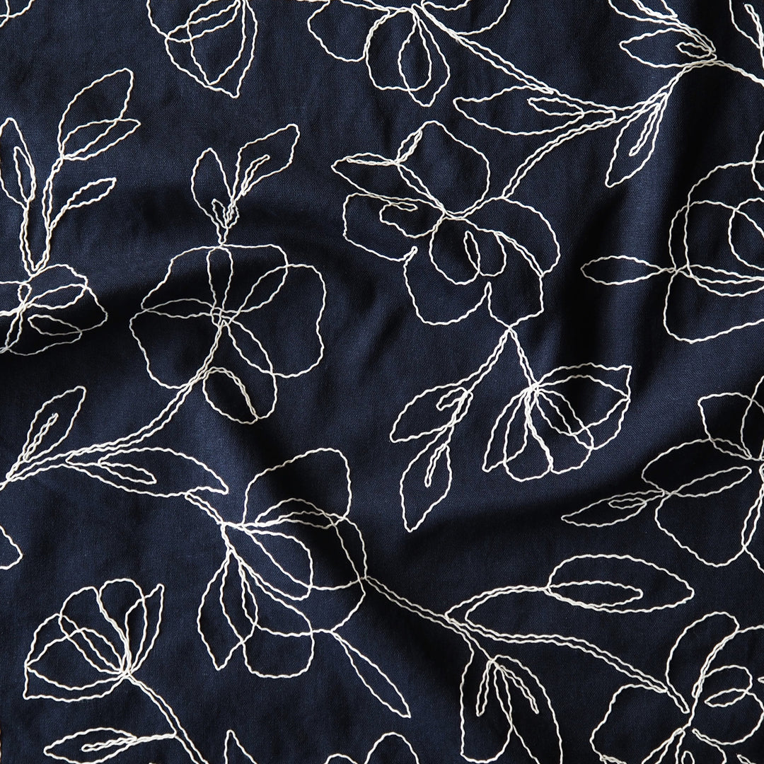 Navy viscose linen dressmaking fabric with embroidered floral pattern