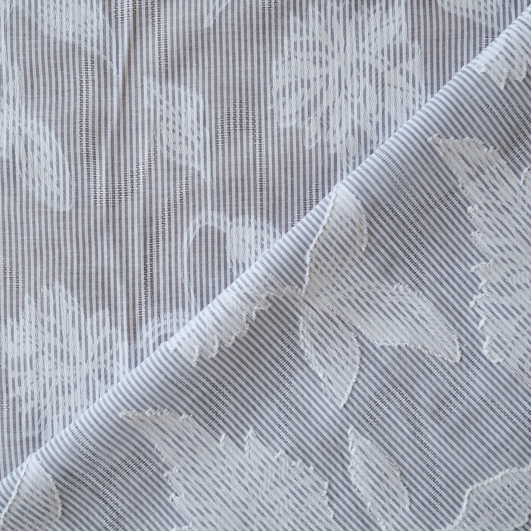 Blue striped jacquard cotton dressmaking fabric with woven floral design